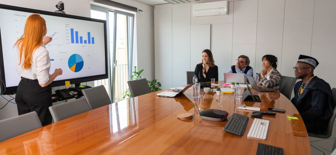 A businesswoman presents slides to her colleagues during a conference (Demo)